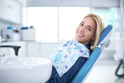 Smiling woman sitting in dental office